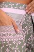 Shorts in printed cotton with front flaps